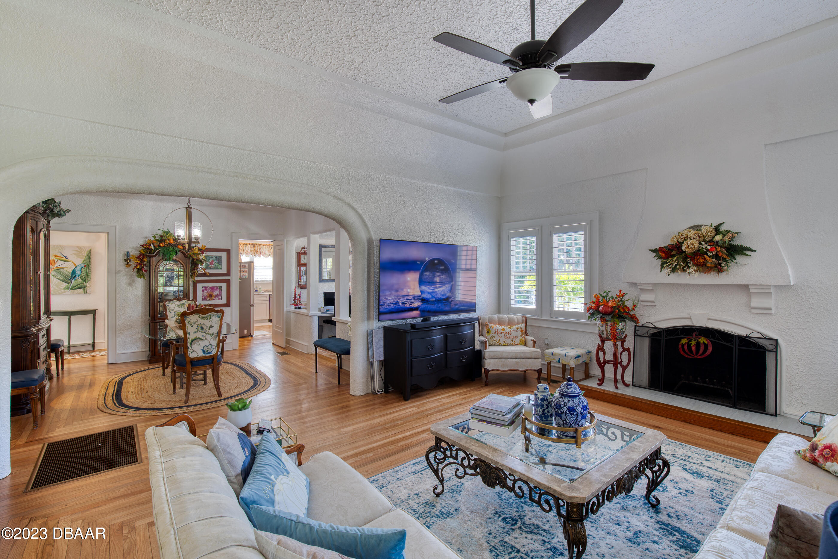 42 River Beach Drive Ormond Beach, FL 32176 - Photo 18 of 74 a living room with furniture and a fireplace