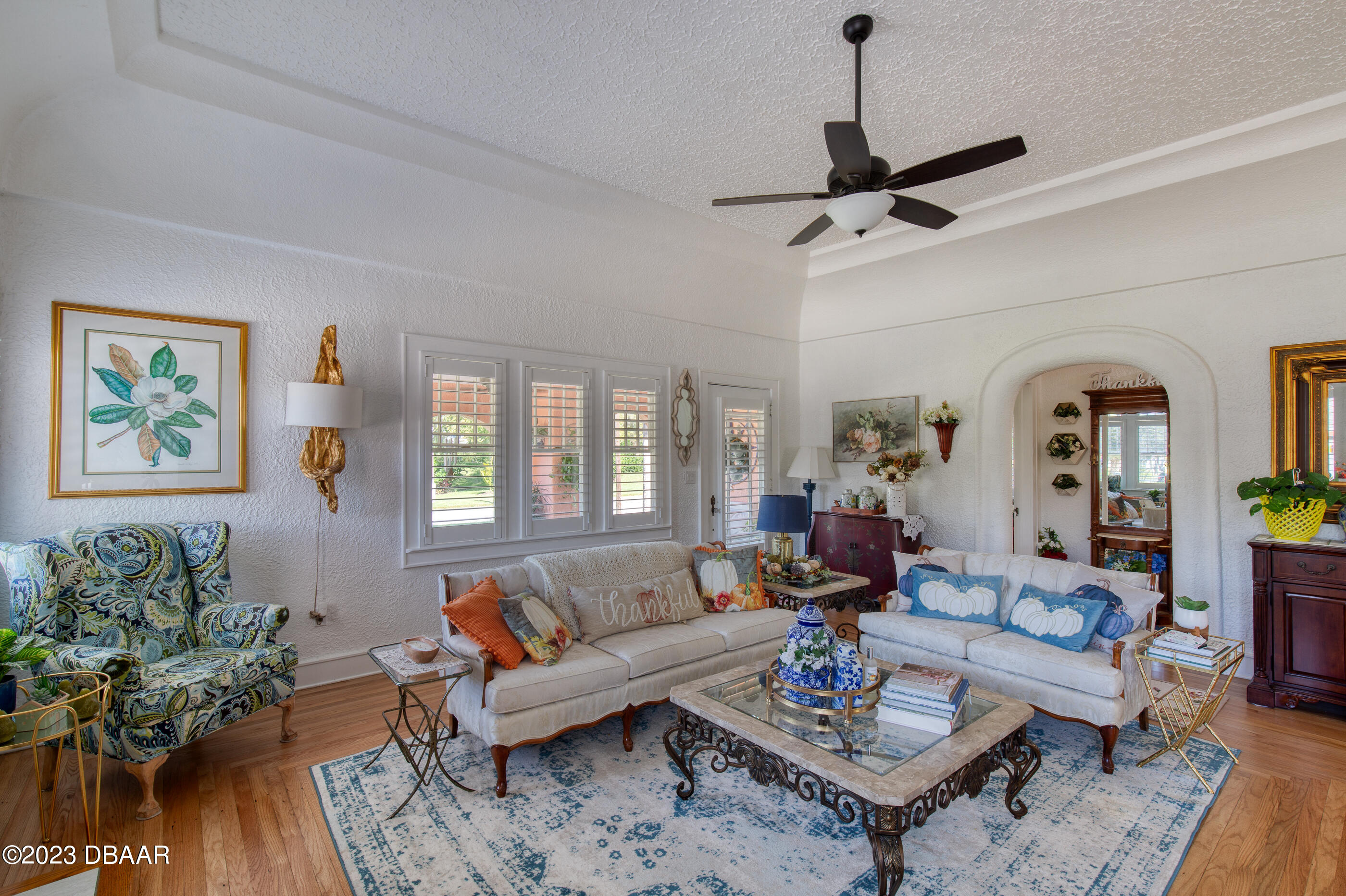 42 River Beach Drive Ormond Beach, FL 32176 - Photo 20 of 74 a living room with furniture potted plant and a window