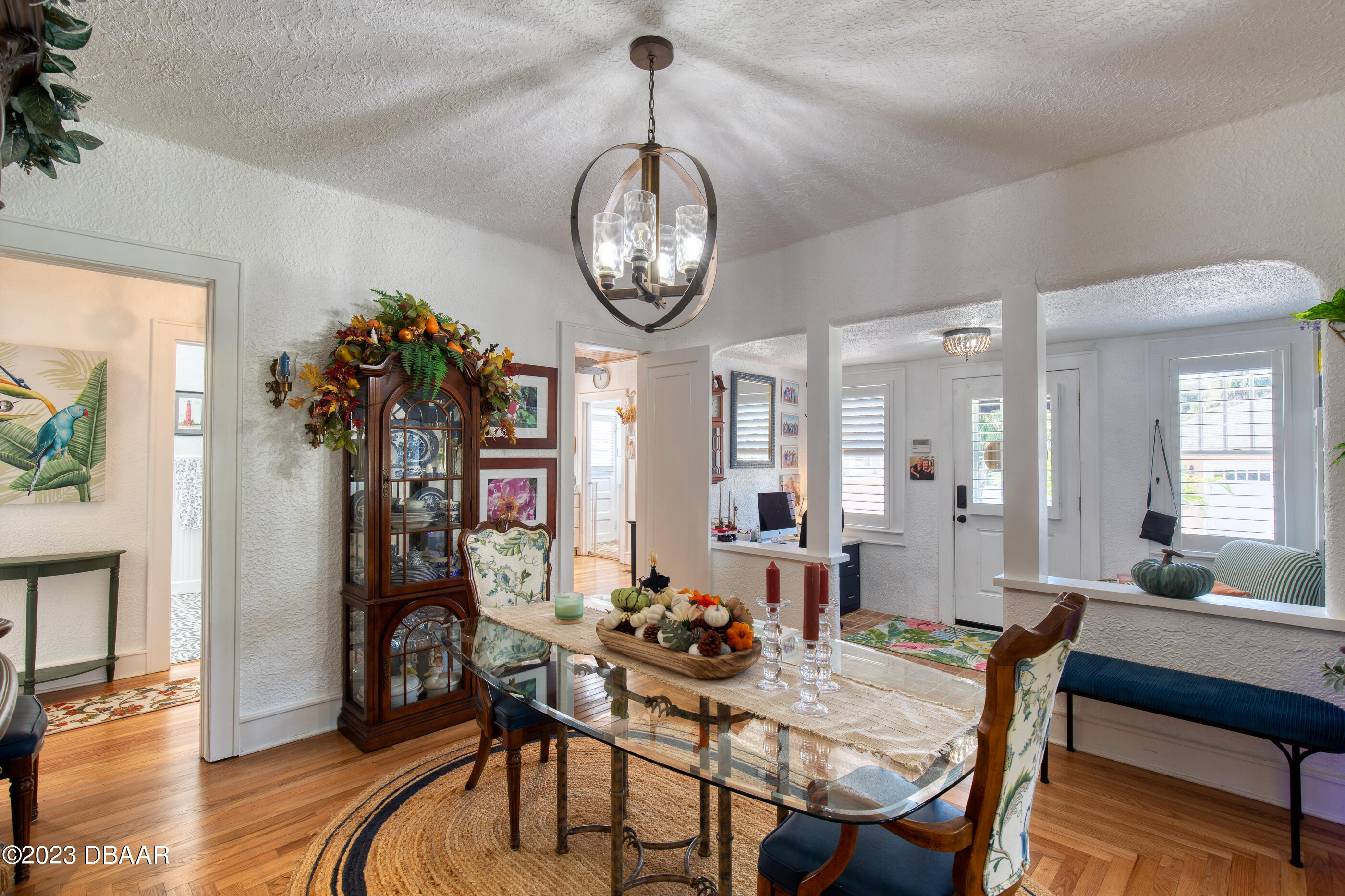 42 River Beach Drive Ormond Beach, FL 32176 - Photo 24 of 74 a view of a dining room with furniture wooden floor and chandelier