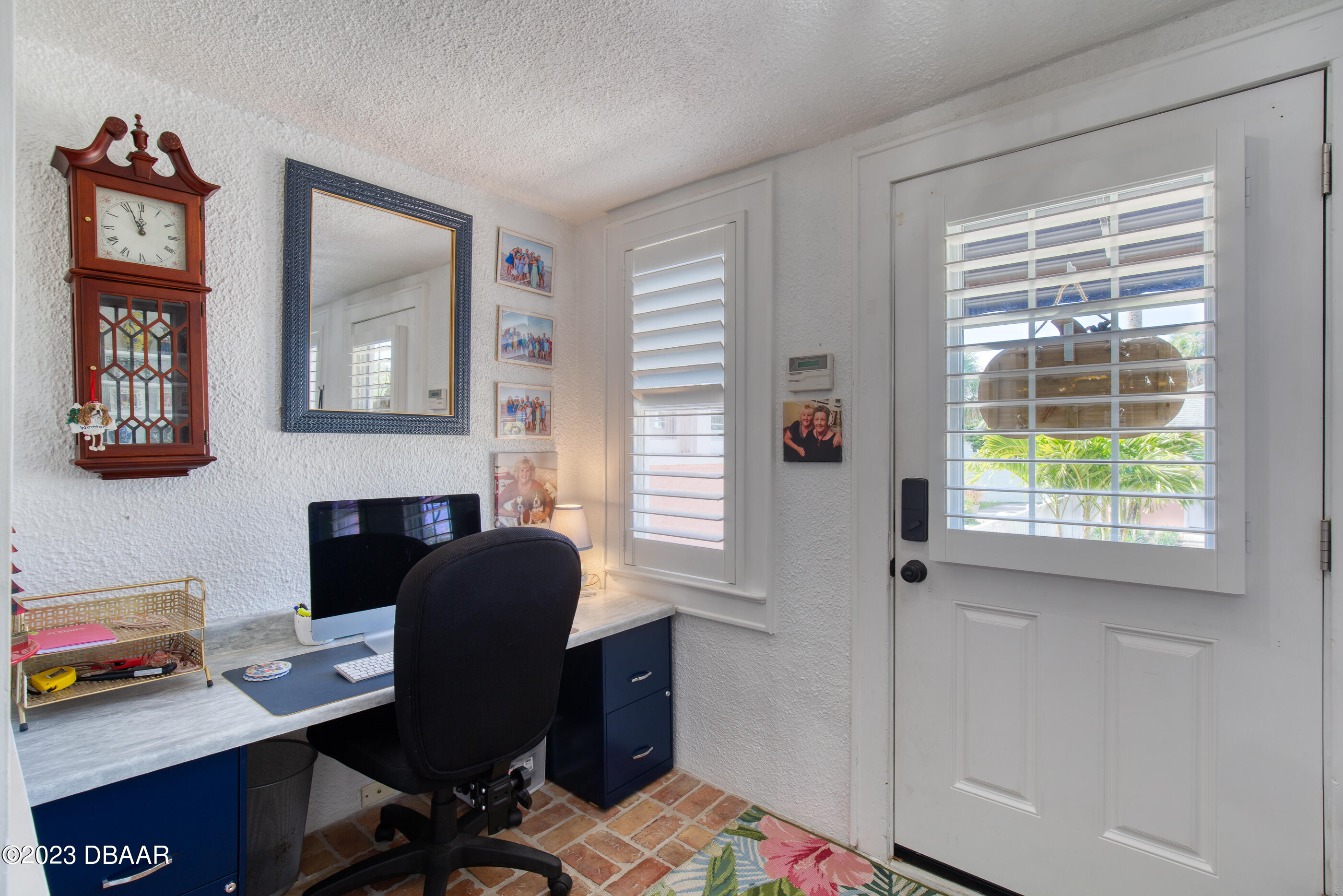 42 River Beach Drive Ormond Beach, FL 32176 - Photo 26 of 74 a view of a workspace with furniture and a window