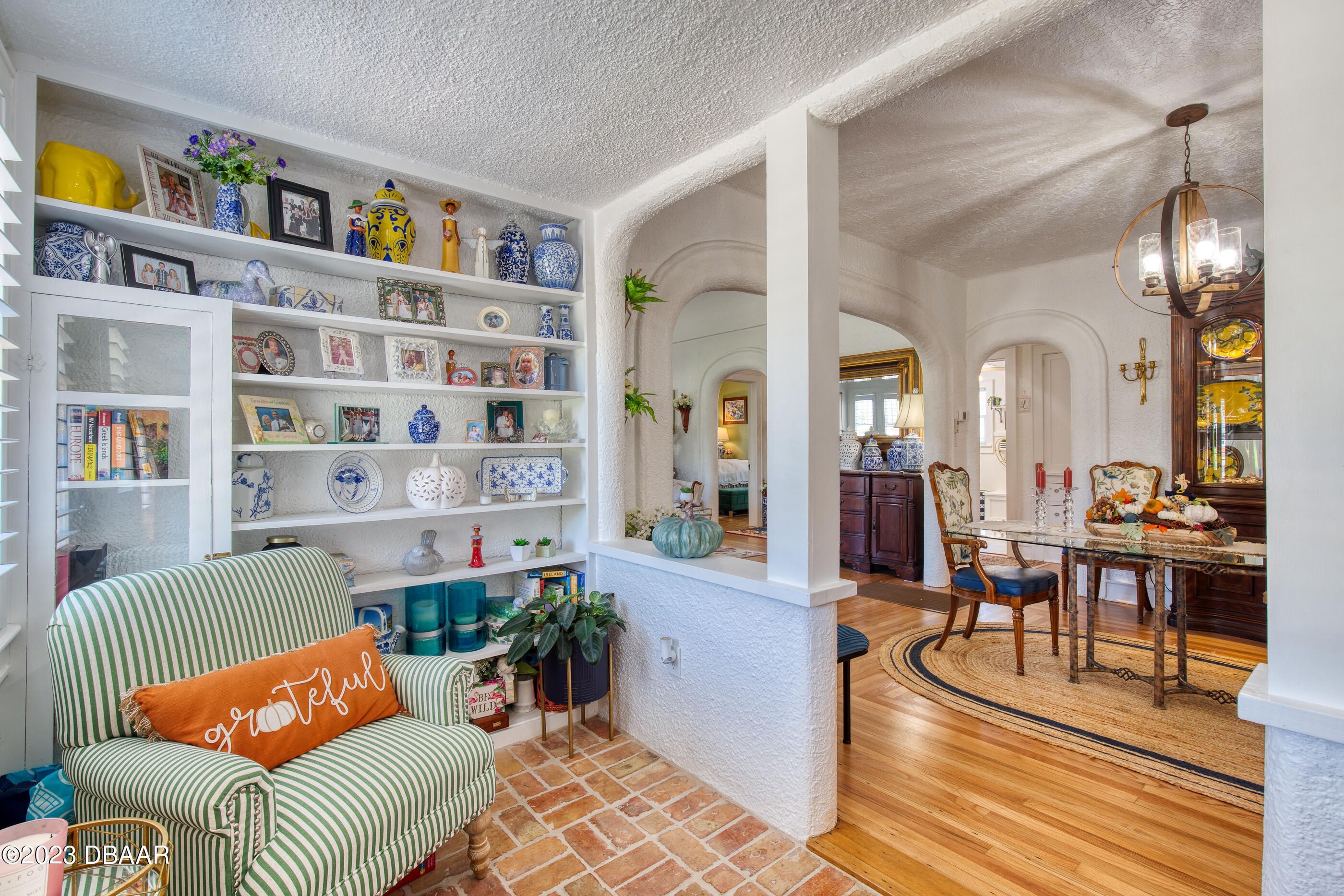 42 River Beach Drive Ormond Beach, FL 32176 - Photo 27 of 74 a living room with furniture and a book shelf