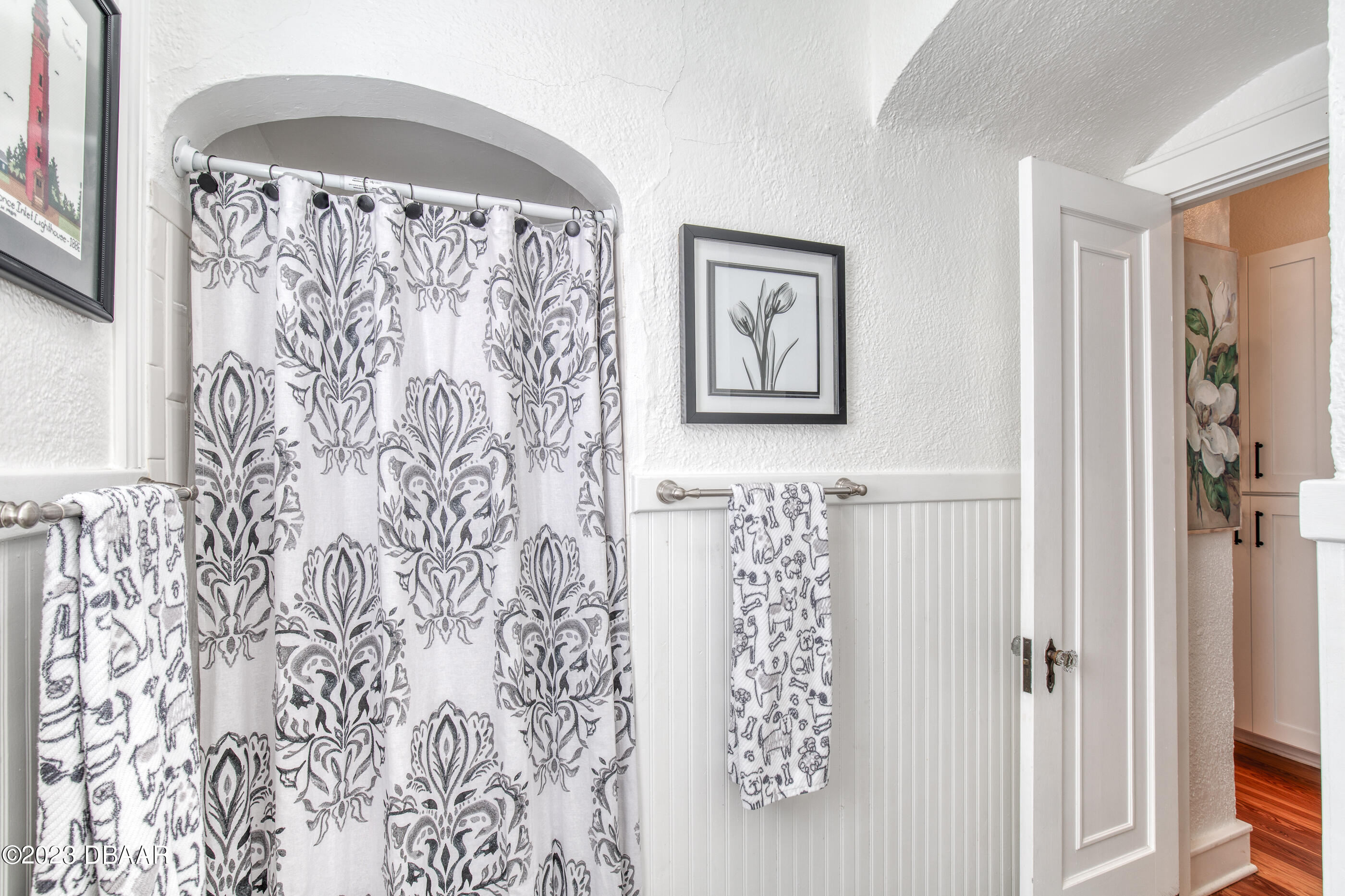 42 River Beach Drive Ormond Beach, FL 32176 - Photo 43 of 74 a bathroom with a shower and a curtain