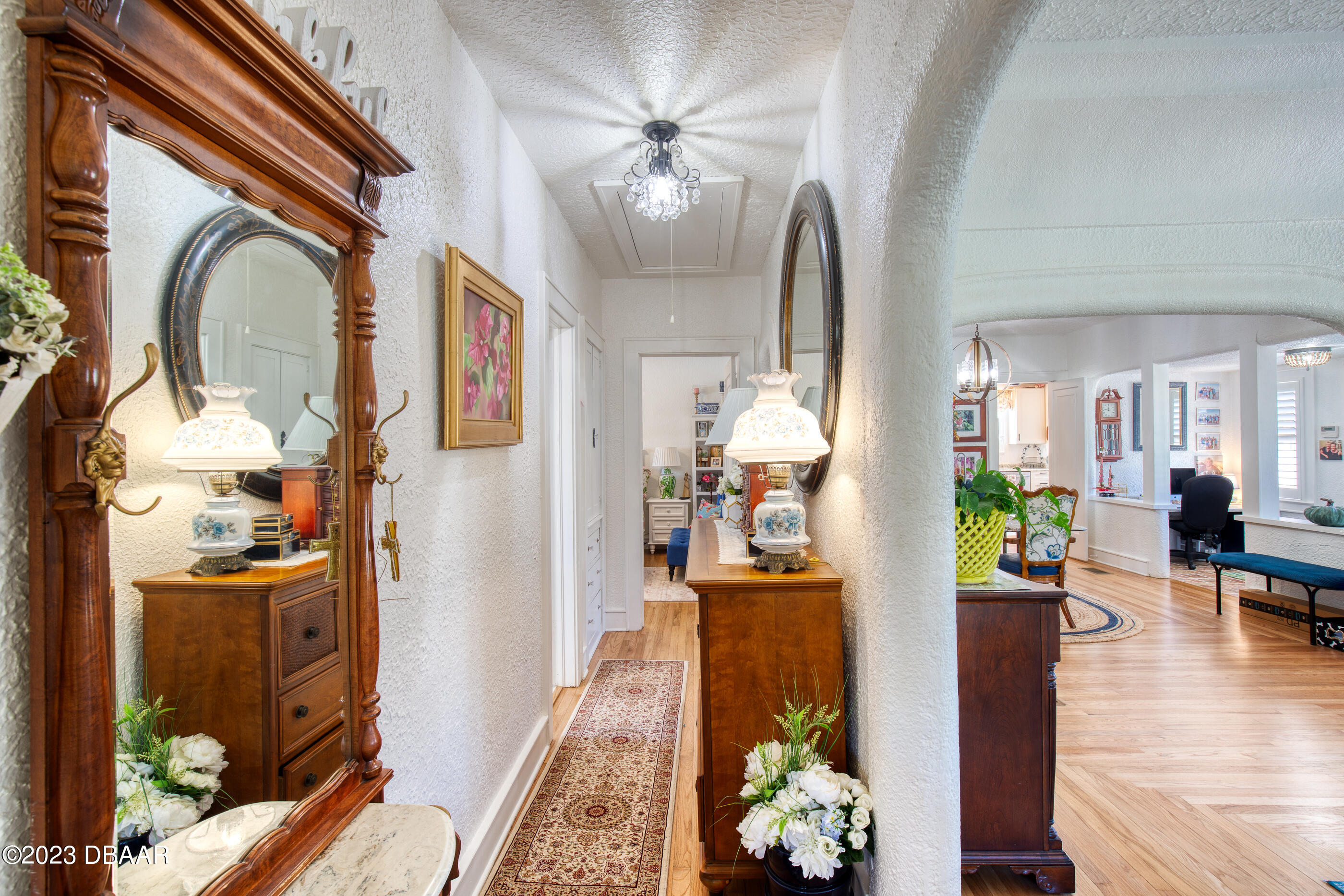 42 River Beach Drive Ormond Beach, FL 32176 - Photo 44 of 74 a view of living room filled with furniture and a chandelier