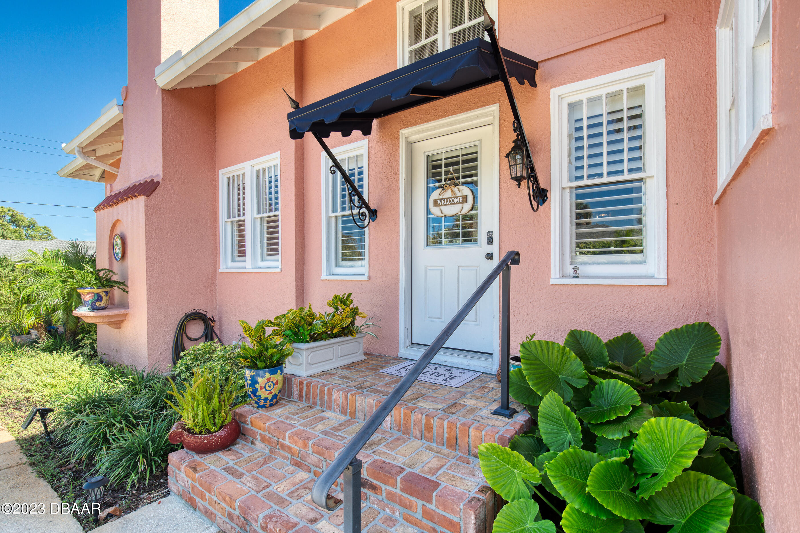 42 River Beach Drive Ormond Beach, FL 32176 - Photo 9 of 74 a front view of a house with a yard