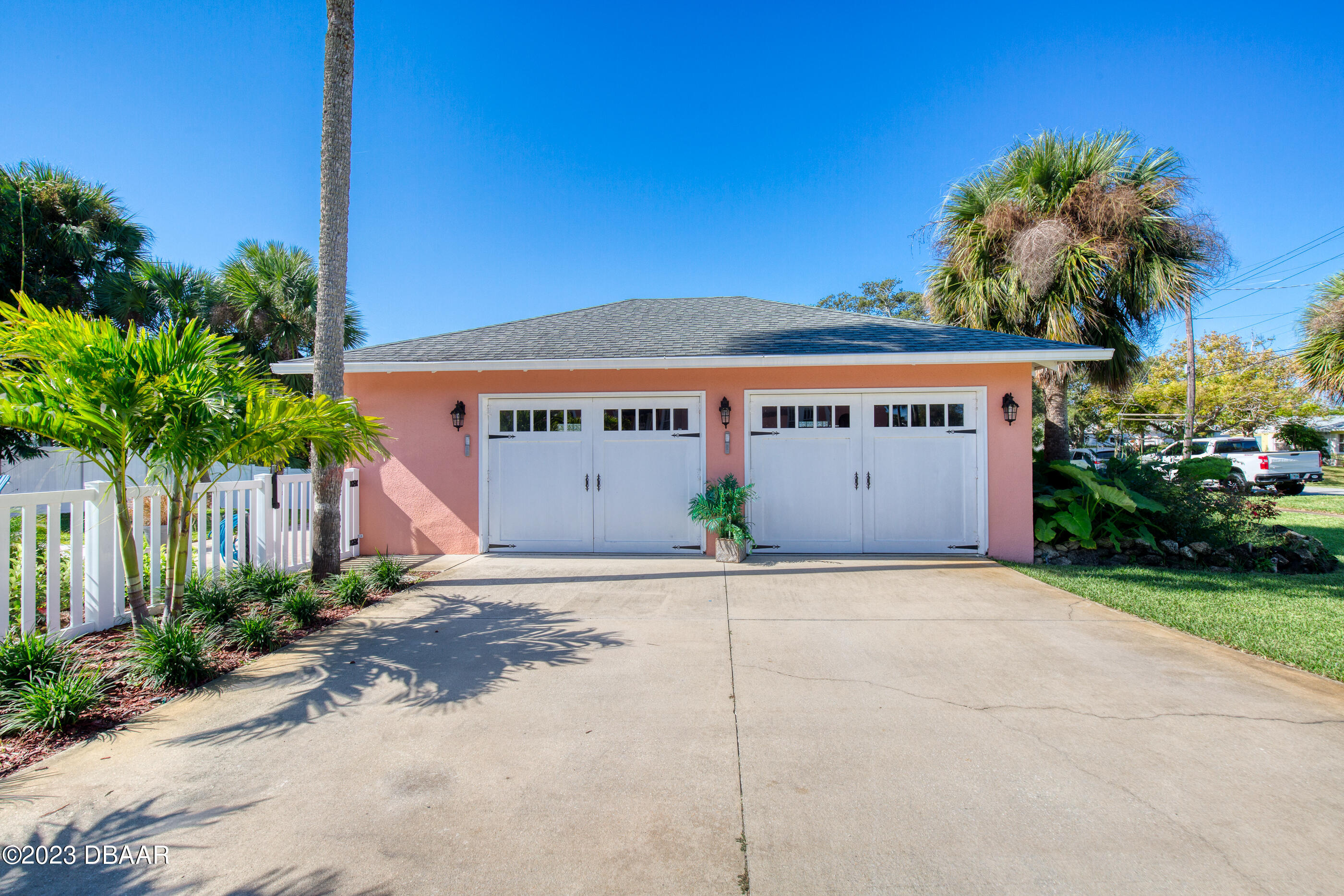 42 River Beach Drive Ormond Beach, FL 32176 - Photo 10 of 74 a house with a yard and a car park in front of it