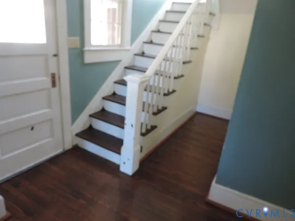 a view of entryway with wooden floor