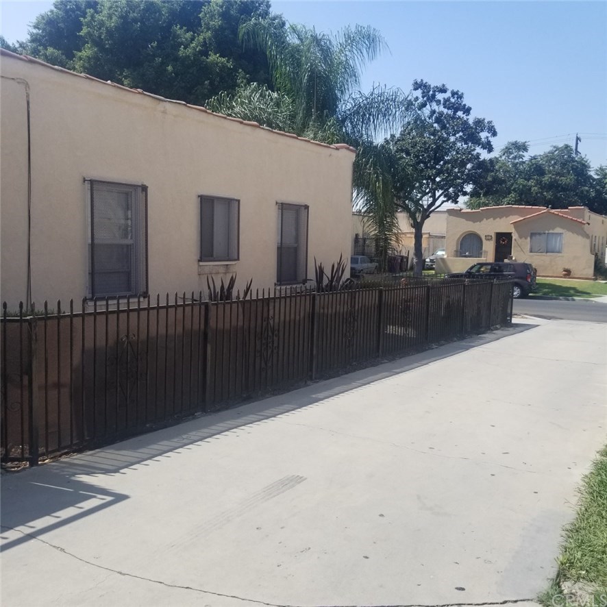 5416 Lime Avenue Long Beach, CA 90805 - Photo 5 of 23 Side View of Front House and Driveway to Rear Units