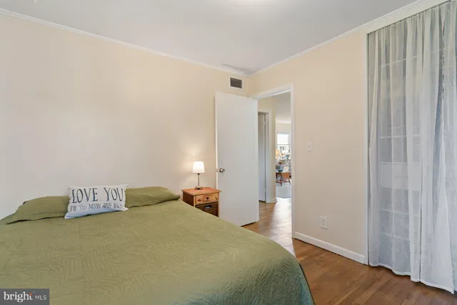 a bedroom with a bed and a table