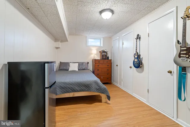 a bedroom with a bed and a walk in closet
