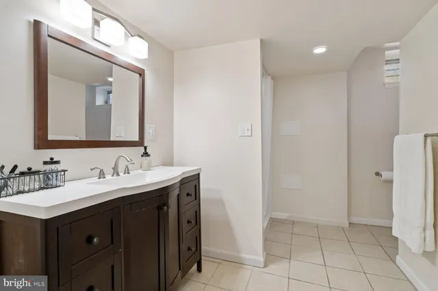 a bathroom with a double vanity sink and mirror