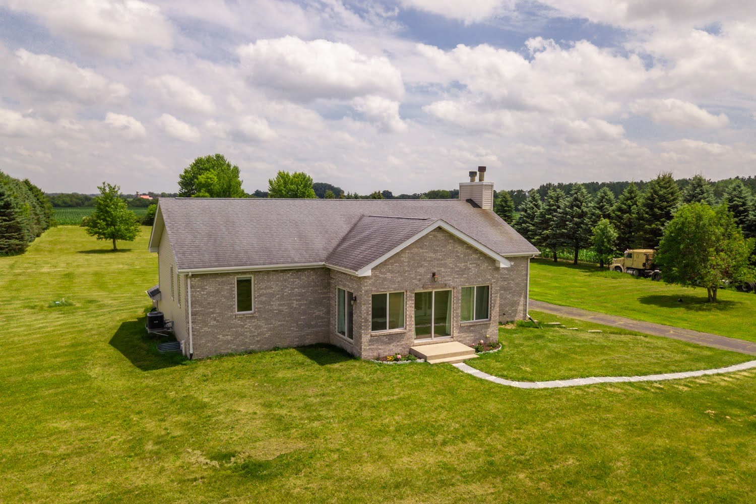 16649 Beaverton Road Capron, IL 61012 - Photo 6 of 48 a view of a house with a backyard