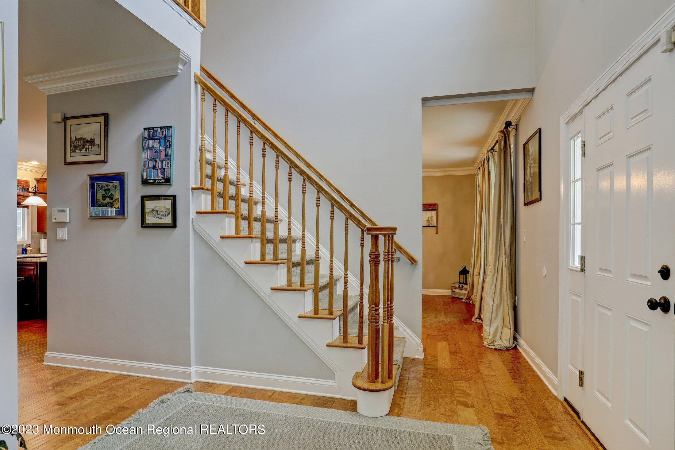 352 Lanes Pond Road Howell, NJ 07731 - Photo 11 of 67 a view of entryway and hall with wooden floor