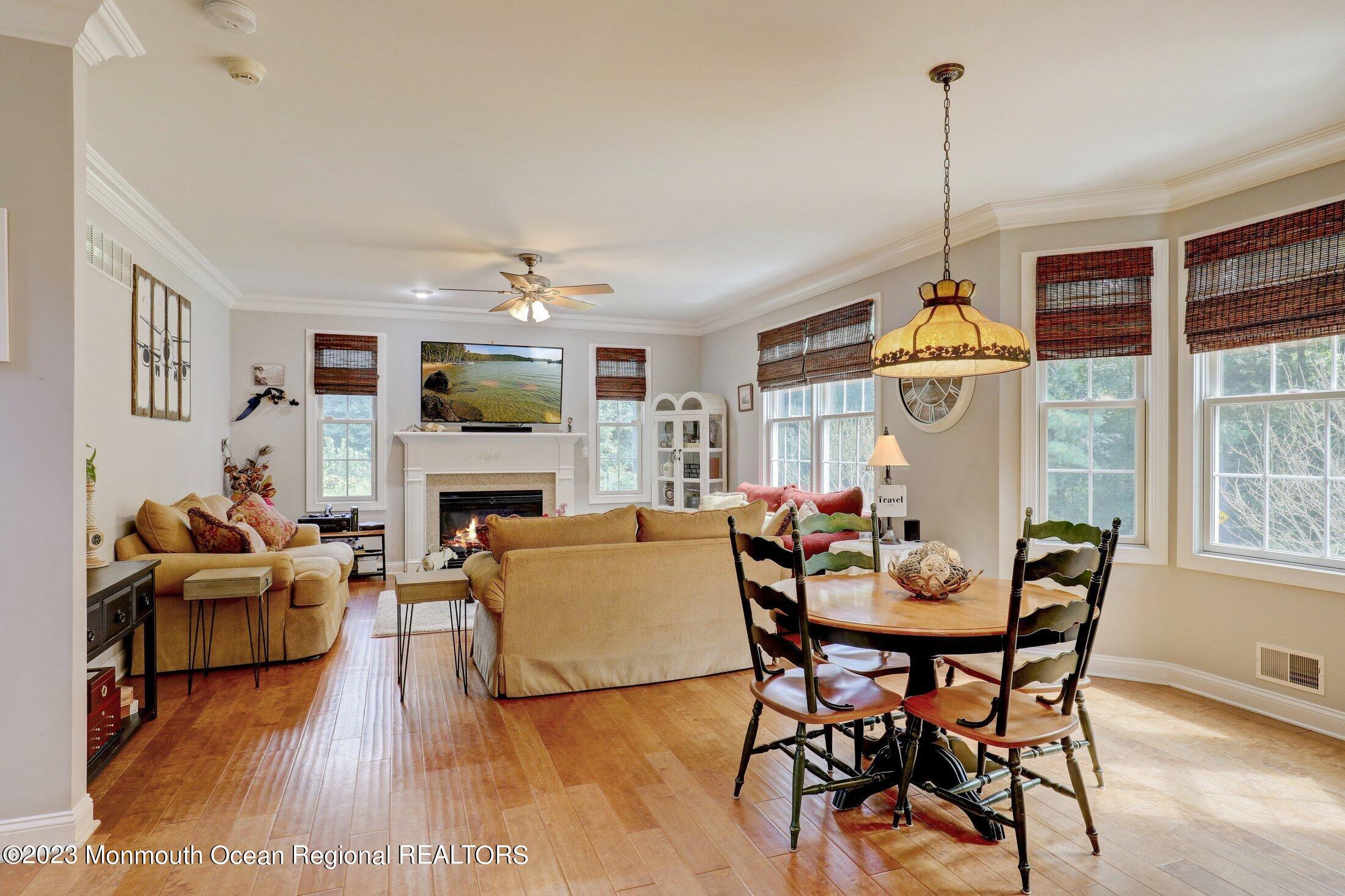 352 Lanes Pond Road Howell, NJ 07731 - Photo 19 of 67 a view of a livingroom with furniture window and wooden floor