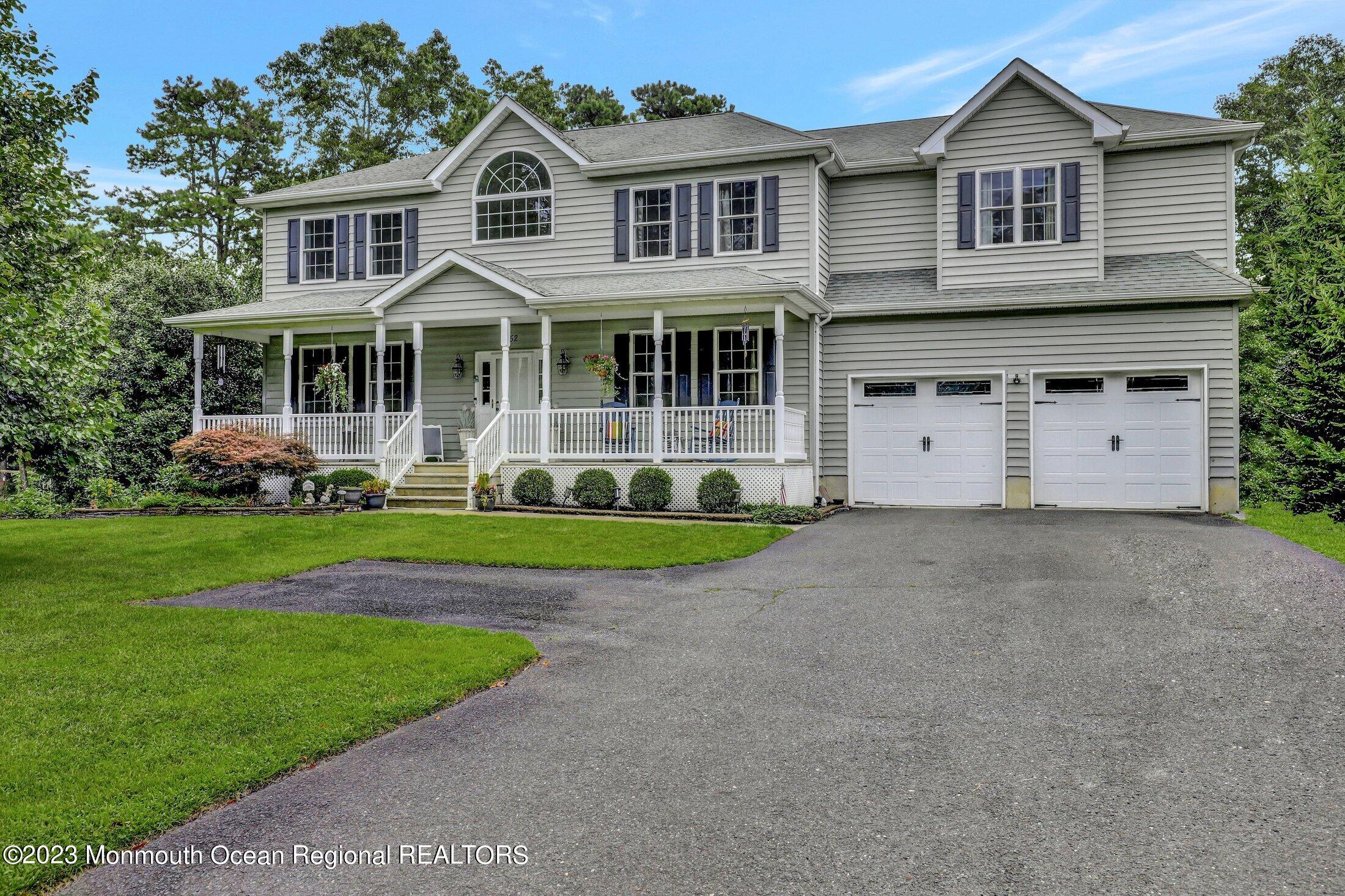 352 Lanes Pond Road Howell, NJ 07731 - Photo 2 of 67 a front view of a house with garden
