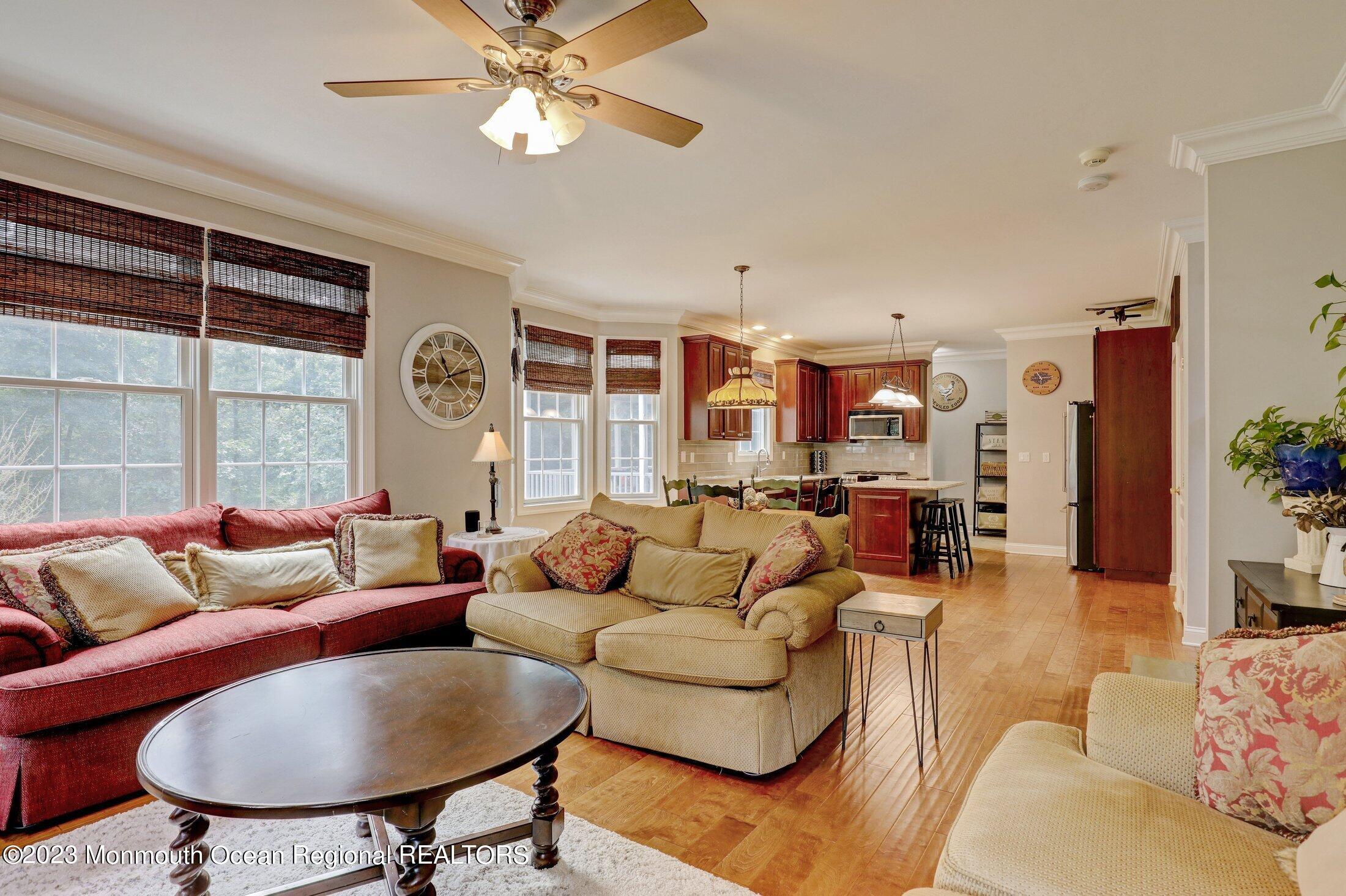 352 Lanes Pond Road Howell, NJ 07731 - Photo 21 of 67 a living room with furniture and a large window