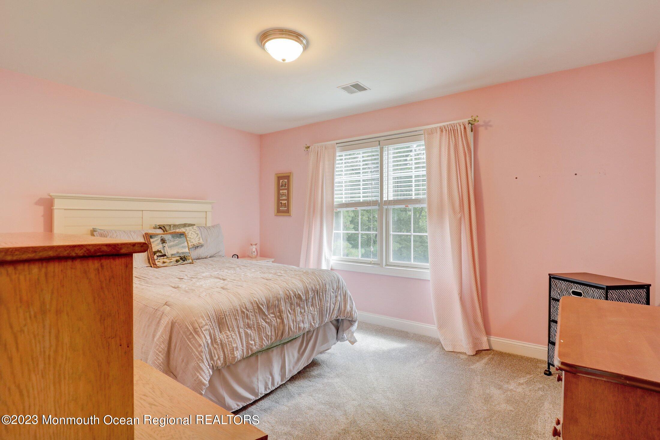 352 Lanes Pond Road Howell, NJ 07731 - Photo 34 of 67 a bedroom with a bed and a window