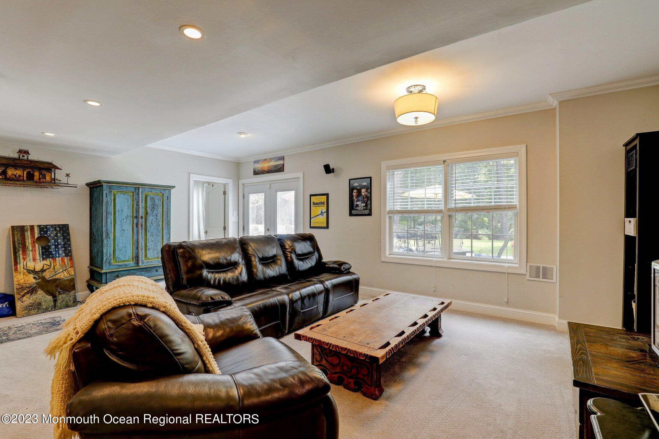 352 Lanes Pond Road Howell, NJ 07731 - Photo 39 of 67 a living room with furniture and a window