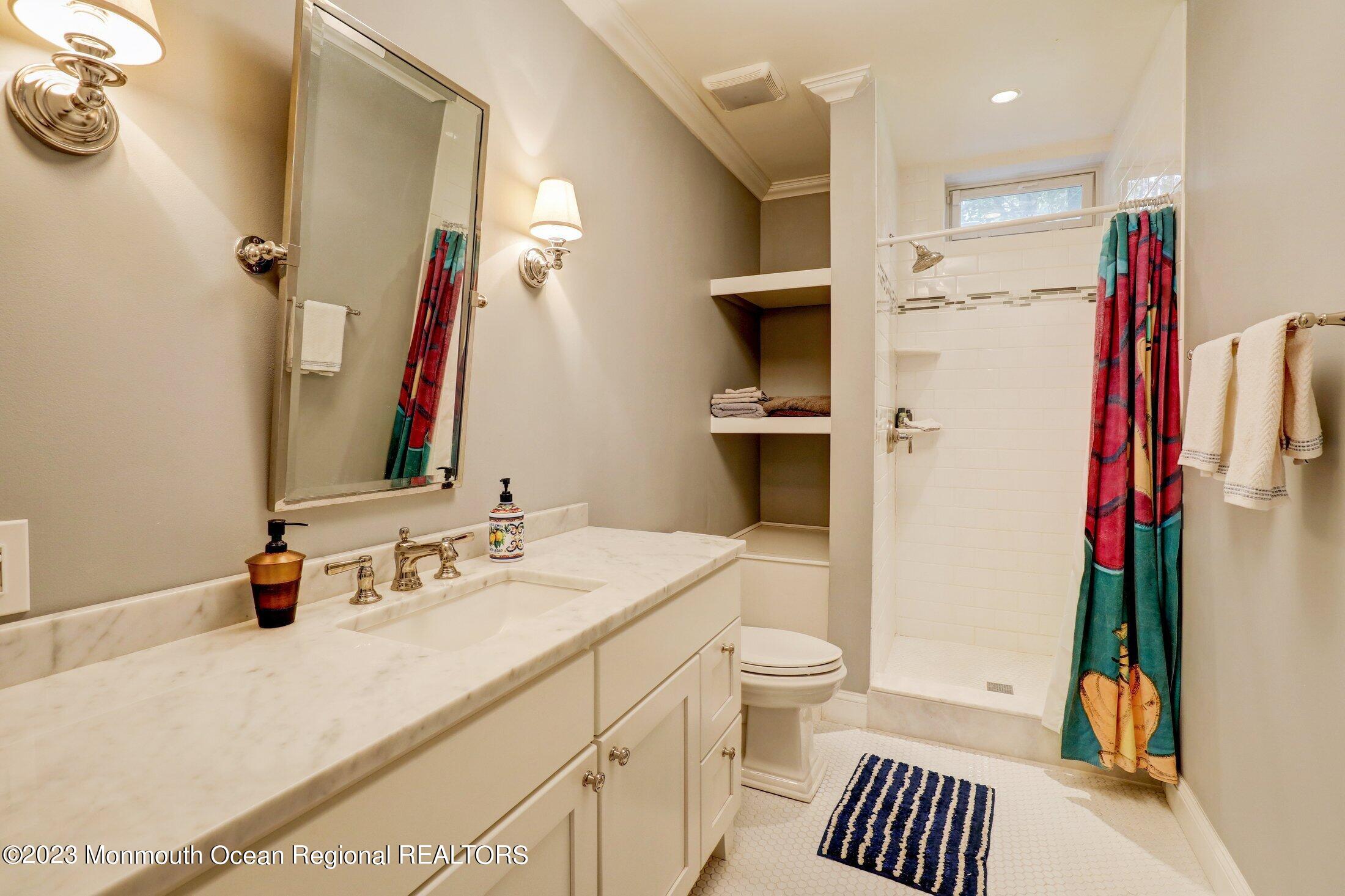 352 Lanes Pond Road Howell, NJ 07731 - Photo 41 of 67 a bathroom with a sink and a mirror
