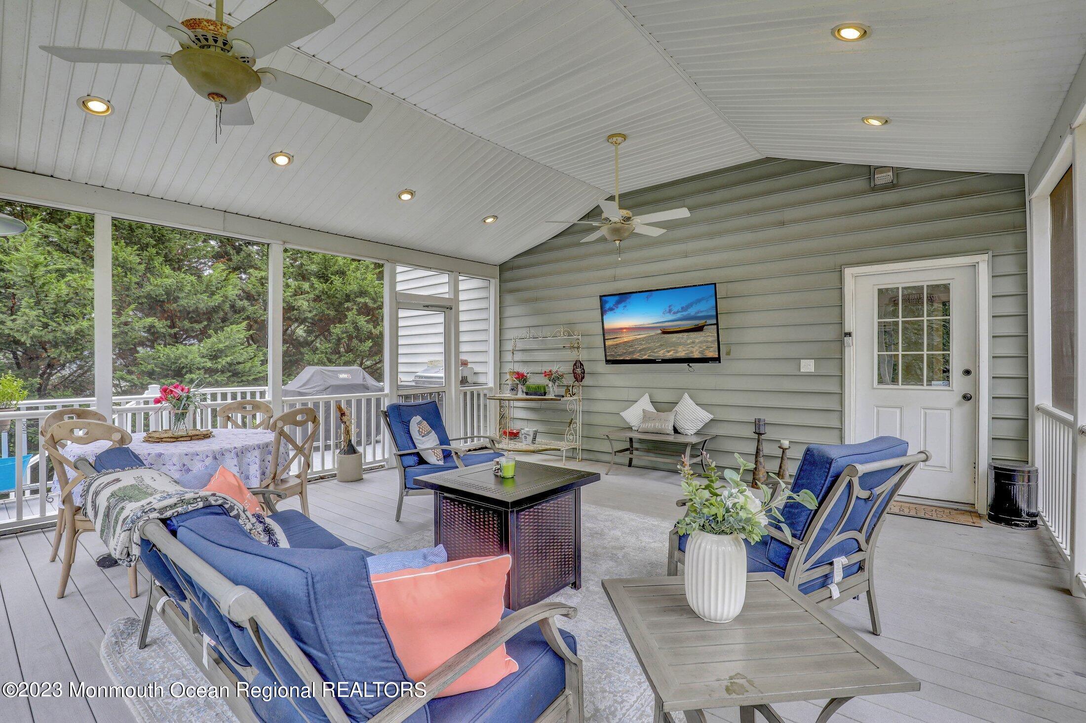352 Lanes Pond Road Howell, NJ 07731 - Photo 48 of 67 a living room with furniture and flat screen tv