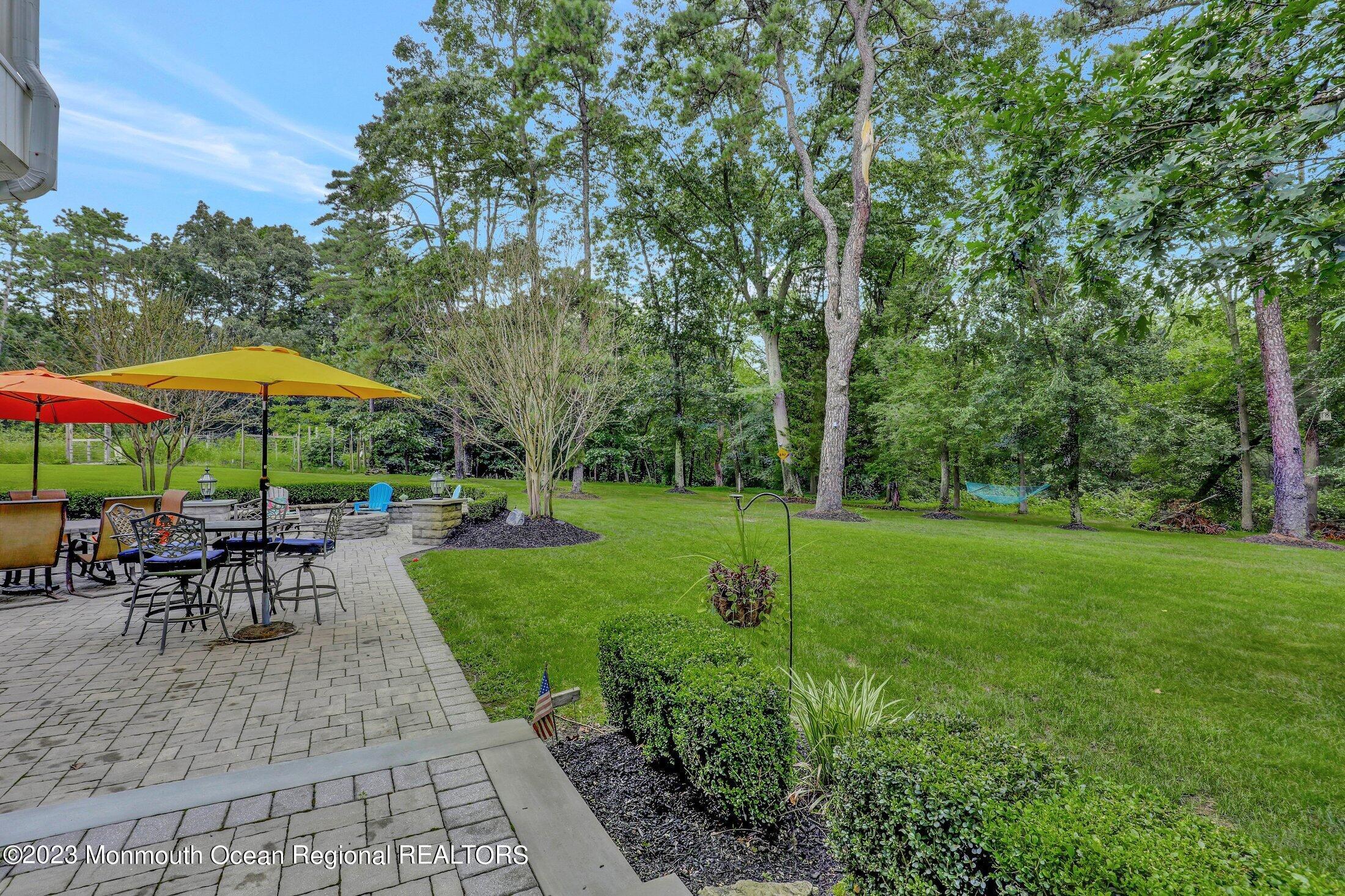 352 Lanes Pond Road Howell, NJ 07731 - Photo 52 of 67 a view of a backyard with sitting area