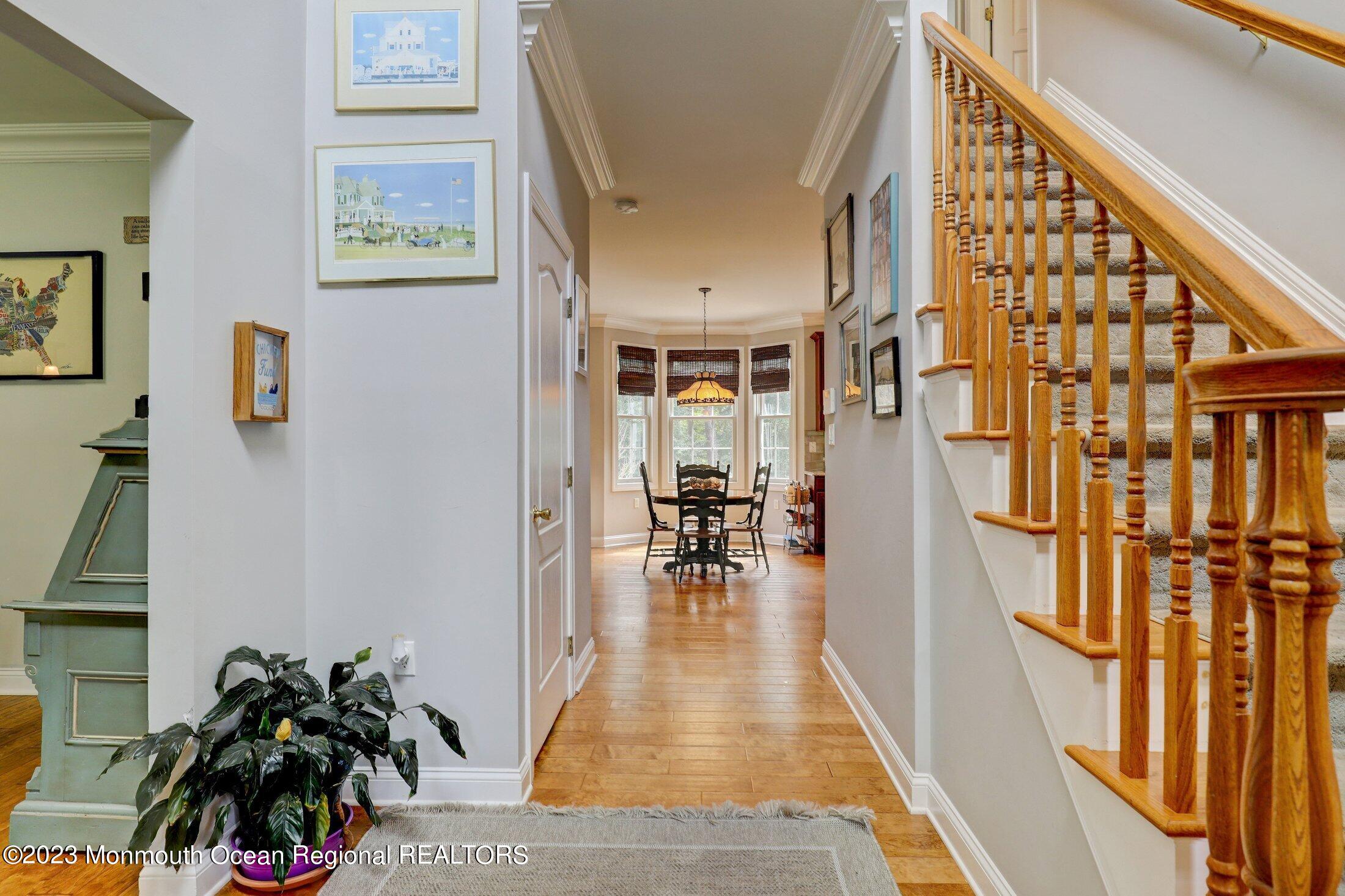 352 Lanes Pond Road Howell, NJ 07731 - Photo 10 of 67 a living room with furniture and a floor to ceiling window