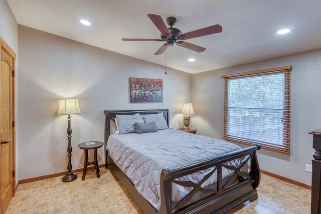 a bedroom with a bed and window