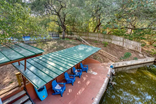 a view of a backyard with sitting area