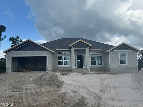 front view of a house with a yard
