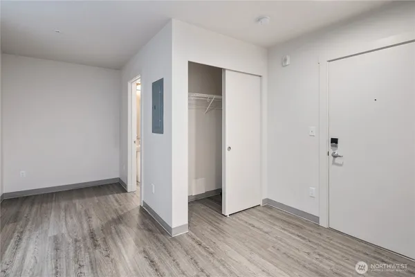 a view of a kitchen from a hallway