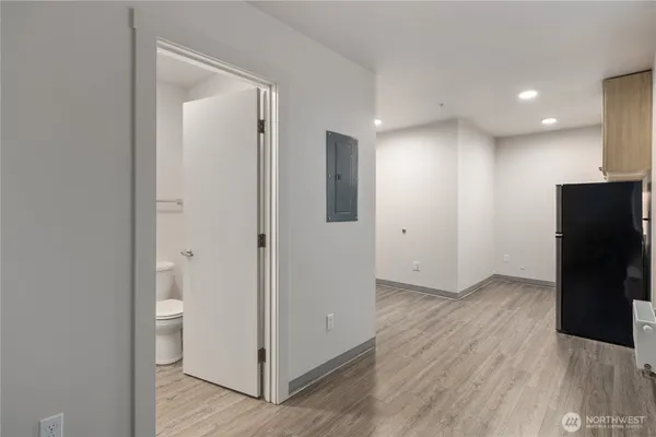 a bathroom with a toilet a sink and shower