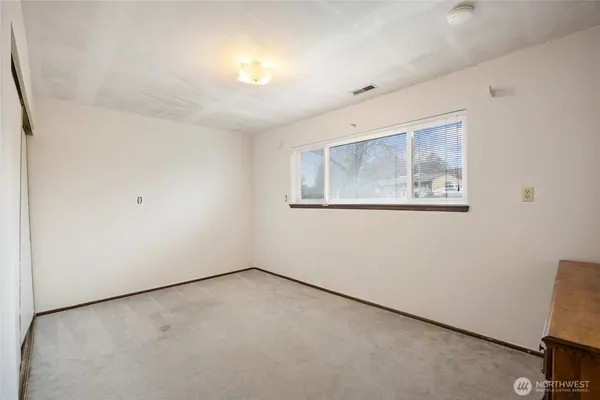 an empty room with a workbench