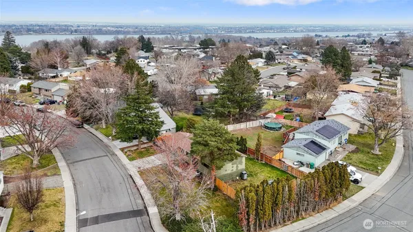 an aerial view of residential houses with outdoor space