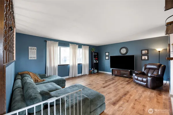 a bedroom with furniture and a fireplace