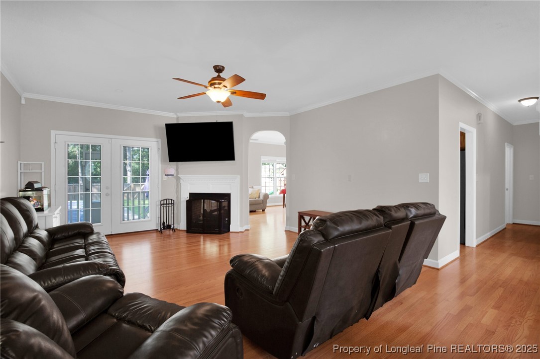 1199 Hunters Trail Hope Mills, NC 28348 - Photo 11 of 45 a living room with furniture a fireplace and a flat screen tv