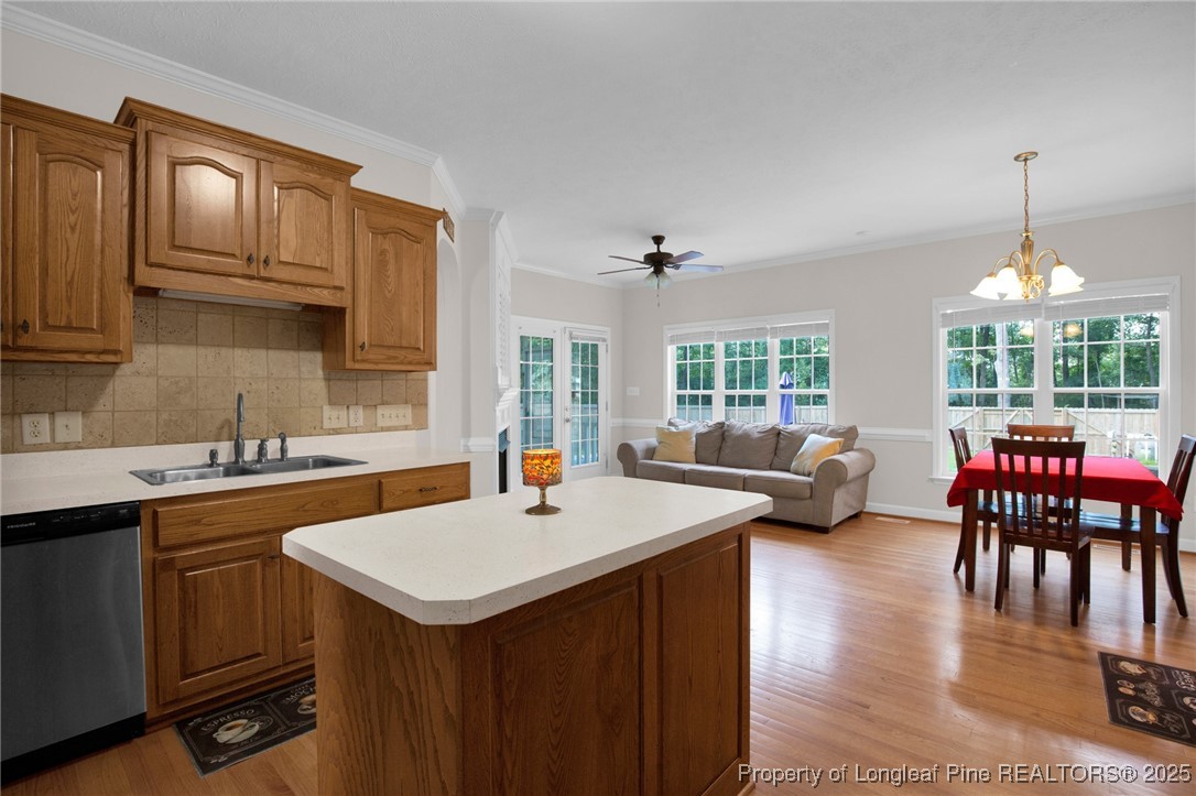1199 Hunters Trail Hope Mills, NC 28348 - Photo 18 of 45 a kitchen with sink refrigerator dining table and chairs