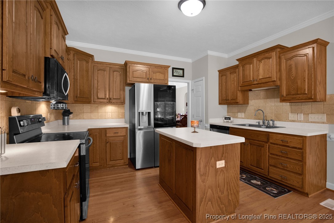 1199 Hunters Trail Hope Mills, NC 28348 - Photo 19 of 45 a kitchen with a sink stove and refrigerator
