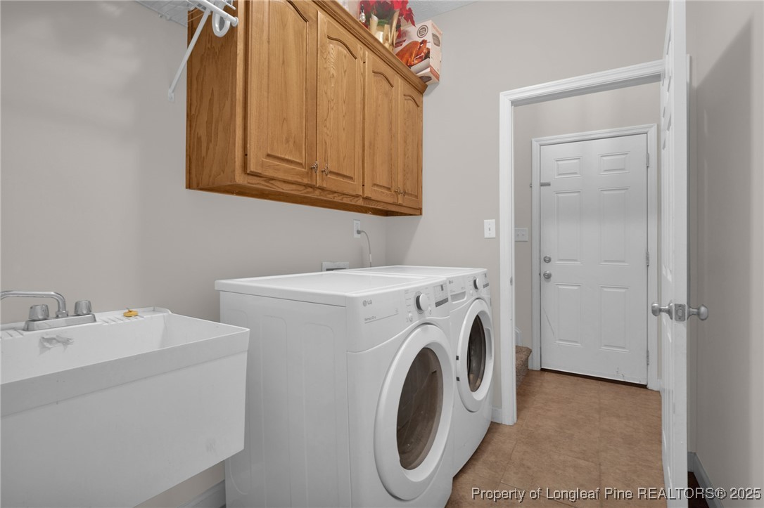 1199 Hunters Trail Hope Mills, NC 28348 - Photo 25 of 45 a utility room with dryer and washer