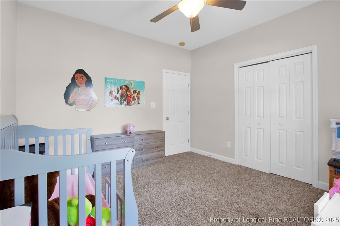 1199 Hunters Trail Hope Mills, NC 28348 - Photo 28 of 45 a living room with furniture and a baby crib