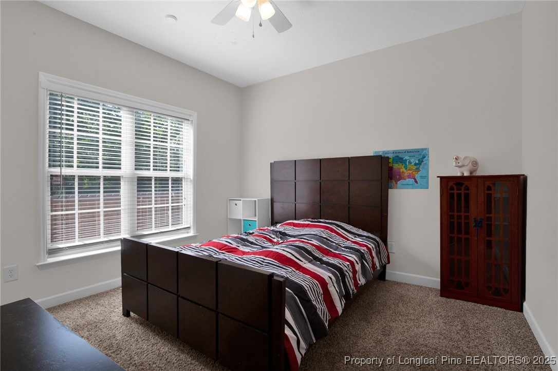 1199 Hunters Trail Hope Mills, NC 28348 - Photo 29 of 45 a bedroom with a bed and a dresser