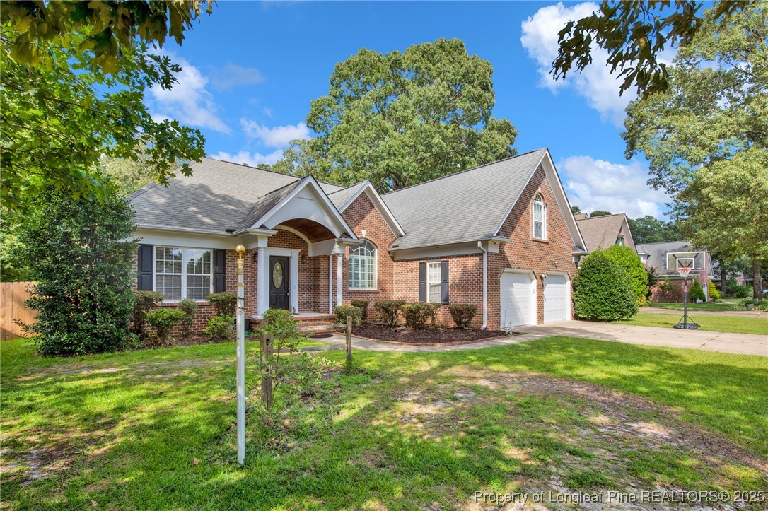 1199 Hunters Trail Hope Mills, NC 28348 - Photo 3 of 45 a front view of house with yard and green space