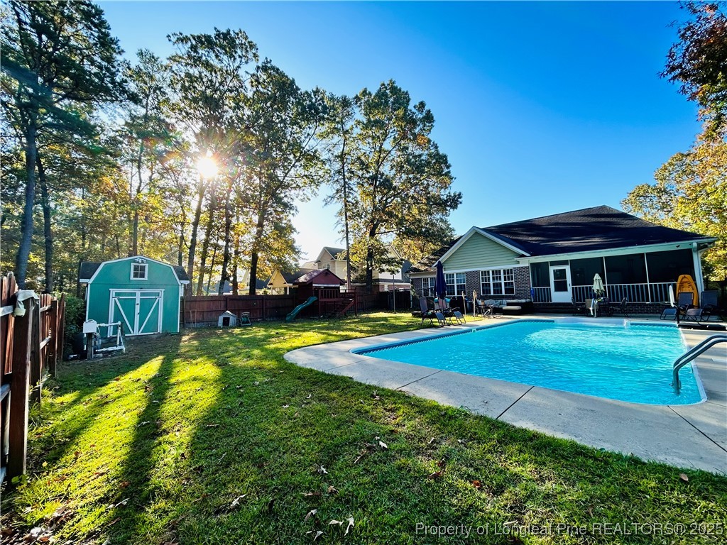 1199 Hunters Trail Hope Mills, NC 28348 - Photo 37 of 45 a view of a house with swimming pool yard and sitting area