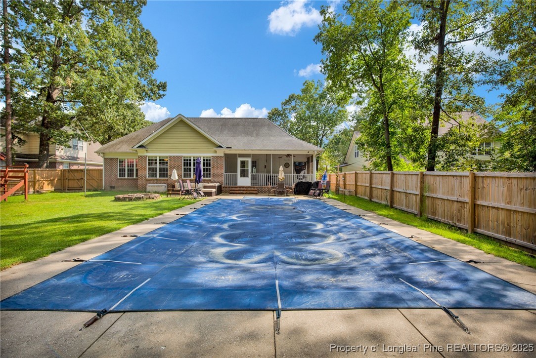 1199 Hunters Trail Hope Mills, NC 28348 - Photo 42 of 45 a view of an house with backyard and a tree