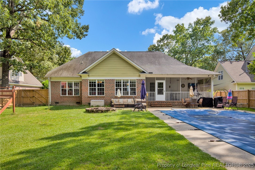 1199 Hunters Trail Hope Mills, NC 28348 - Photo 43 of 45 a front view of a house with a garden and trees