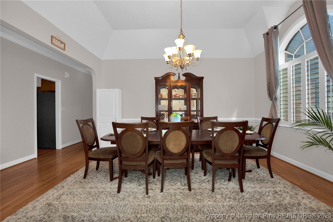 1199 Hunters Trail Hope Mills, NC 28348 - Photo 6 of 45 a view of a dining room with furniture and chandelier