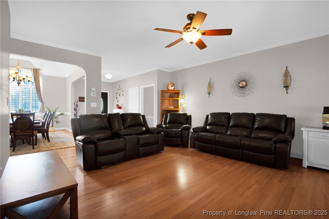 1199 Hunters Trail Hope Mills, NC 28348 - Photo 8 of 45 a living room with furniture and a view of kitchen