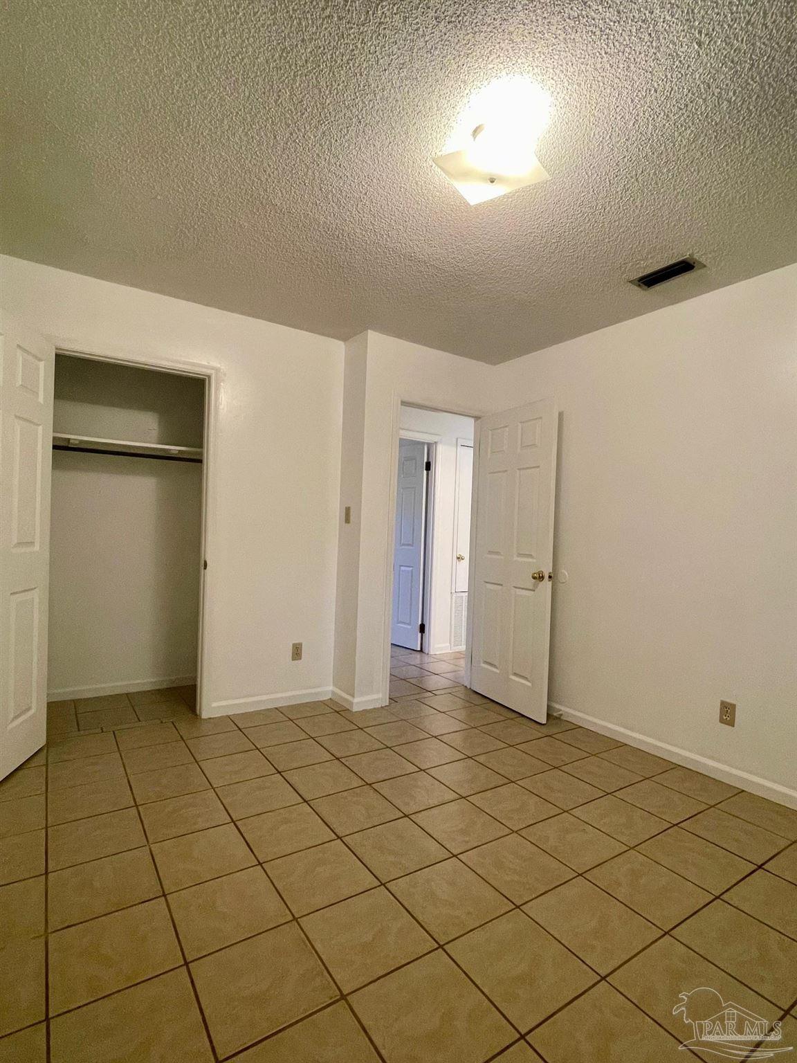 6455 Maddox Road Milton, FL 32570 - Photo 6 of 13 a view of an empty room and wooden floor
