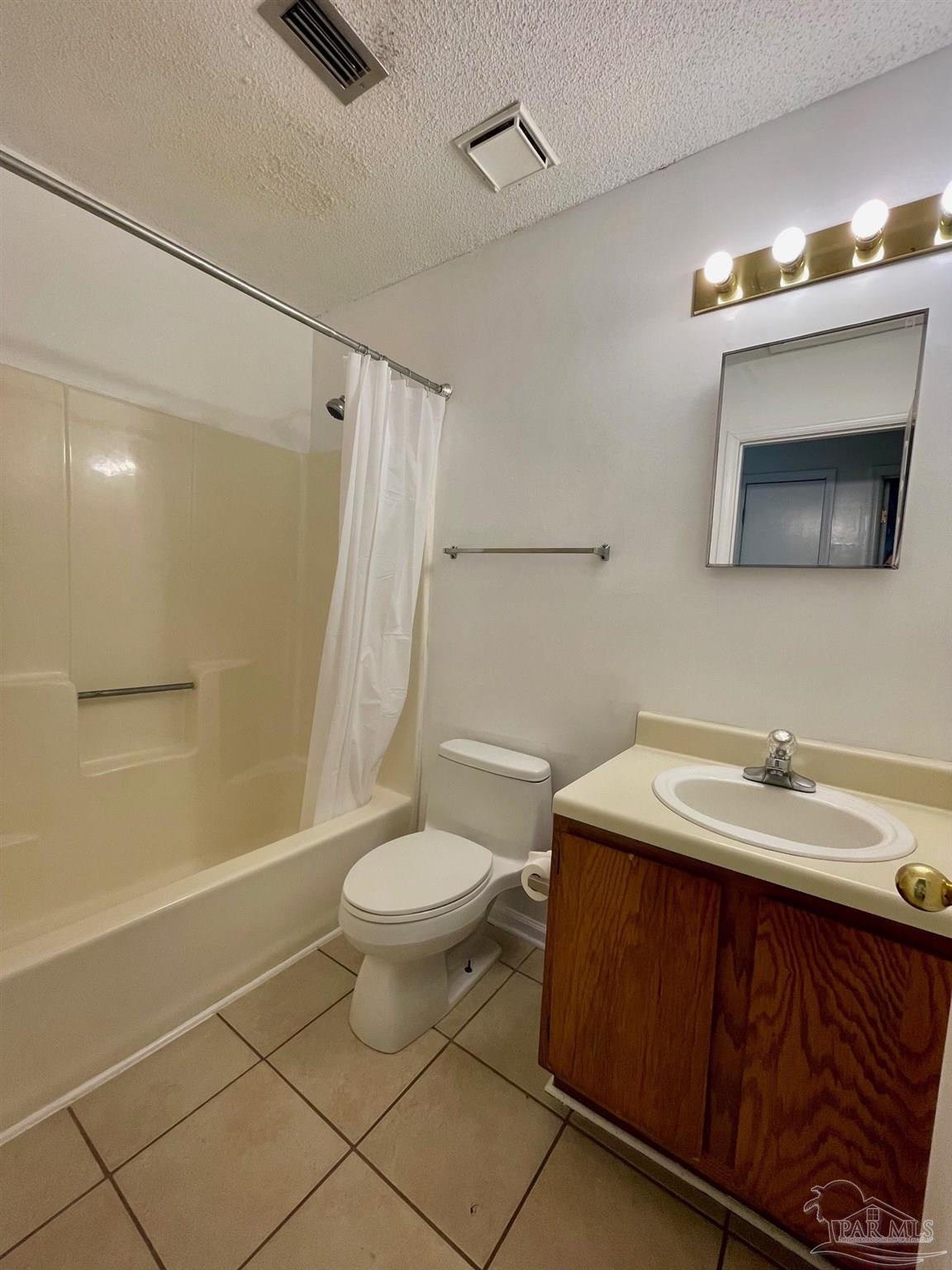 6455 Maddox Road Milton, FL 32570 - Photo 7 of 13 a bathroom with a sink a toilet and shower