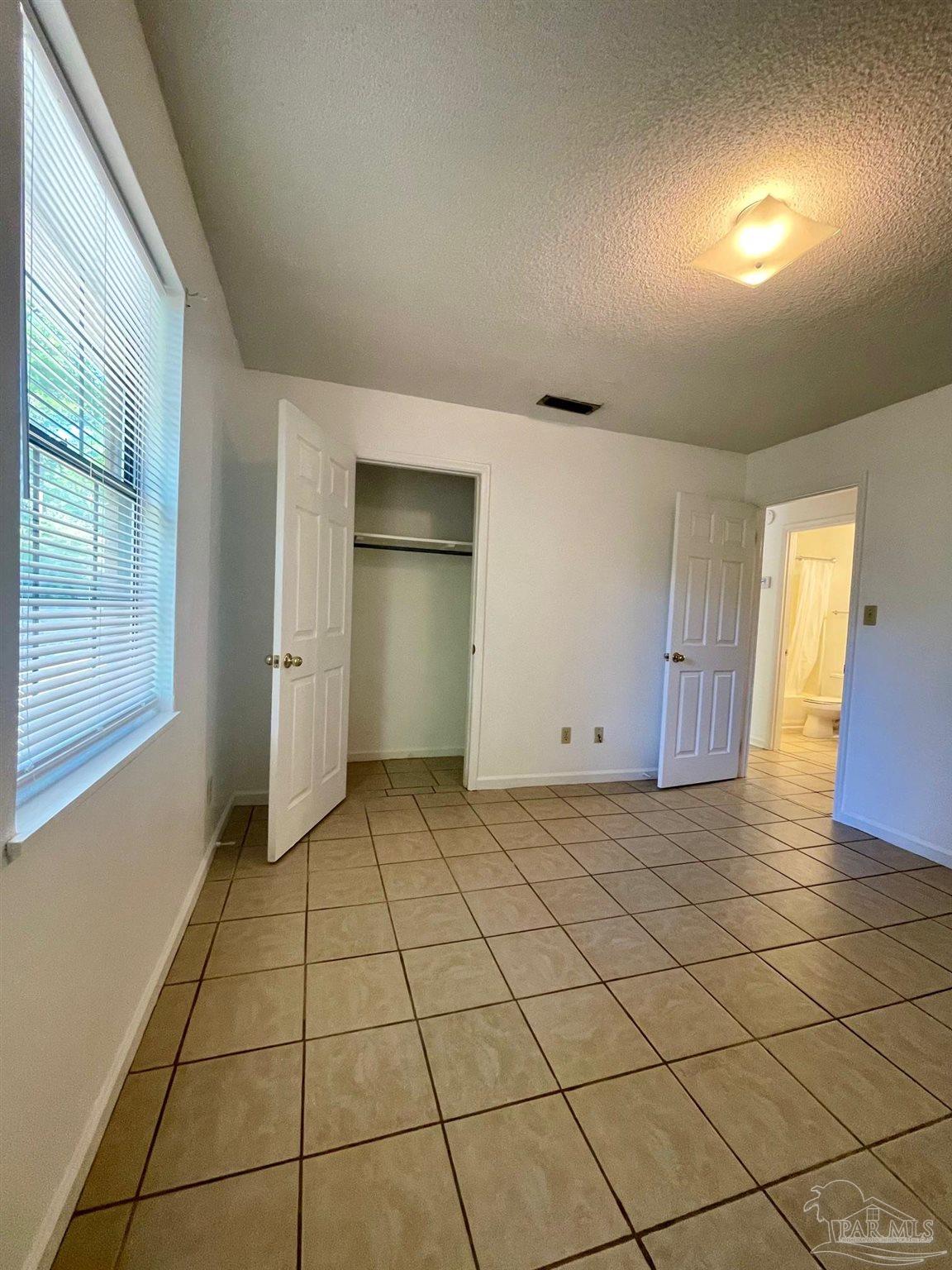 6455 Maddox Road Milton, FL 32570 - Photo 9 of 13 a view of an empty room and window