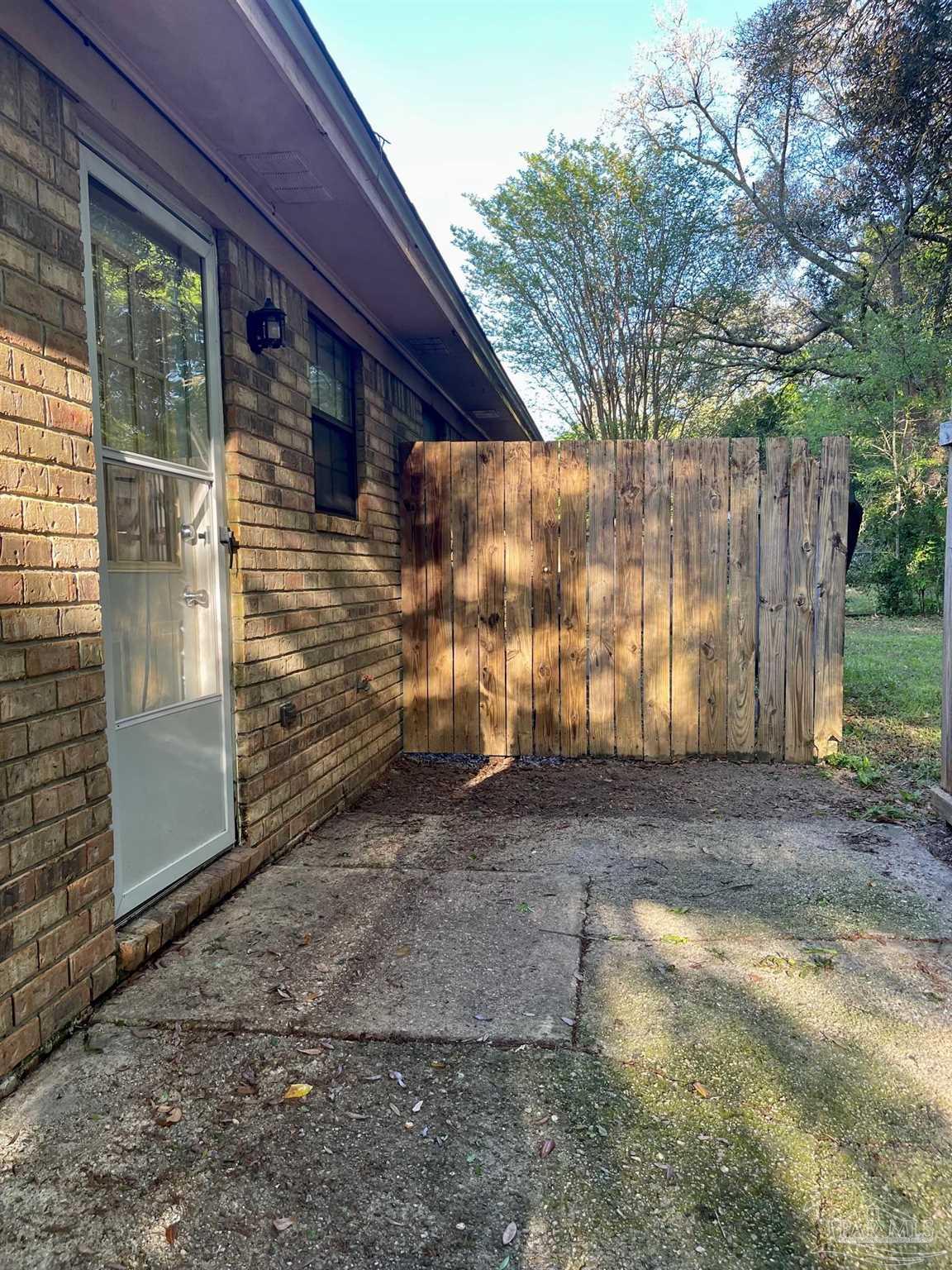 6455 Maddox Road Milton, FL 32570 - Photo 10 of 13 a view of a house with a yard