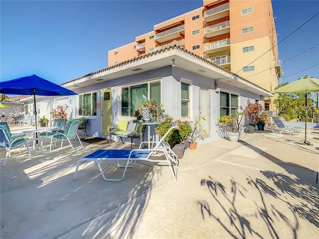 a view of a livingroom with furniture and a potted plant